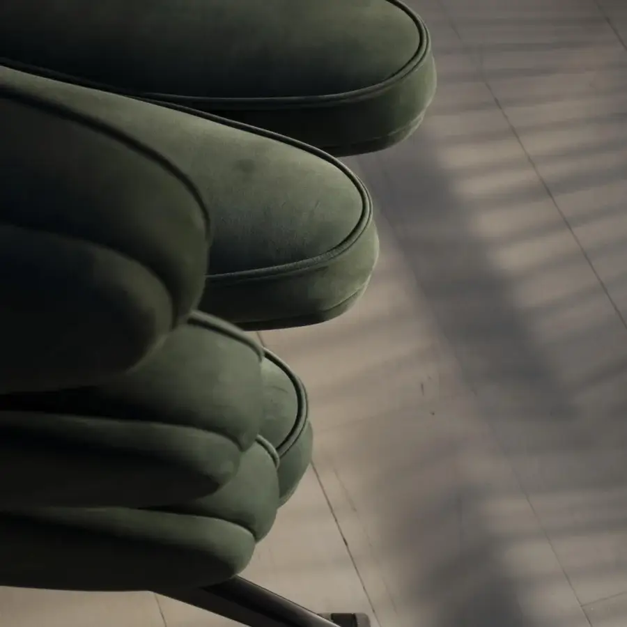 Lavish Mascheroni Airone chair built with birch shaped wood and steel, upholstered in deep green velvet with a shiny swivel base