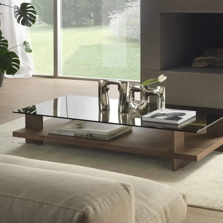 Elegant Pacini & Cappellini Corallo coffee table with a tempered glass top and veneered ash lower shelf in a medium-toned brown finish