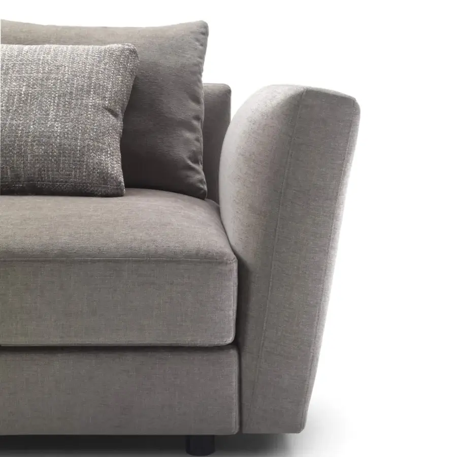 Exceptional Pacini & Cappellini Ester sofa upholstered in matte medium gray fabric with curved armrests and dark wooden feet