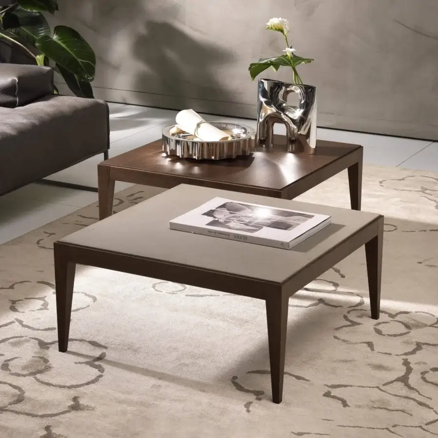 Distinguished Pacini & Cappellini Dominique coffee table with a dark brown wood structure and light gray cimento® tabletop finish