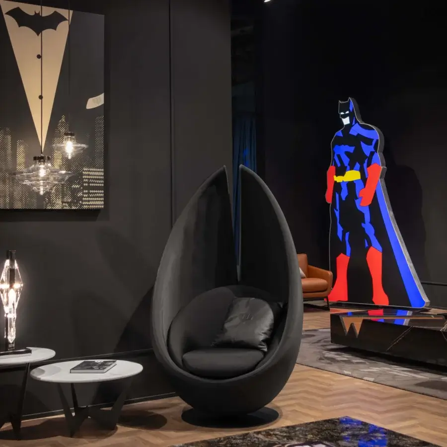 Elegant WAYNE Enterprises WE-003H lounge chair crafted in premium black leather with a glossy black metal swivel base and textile cushion