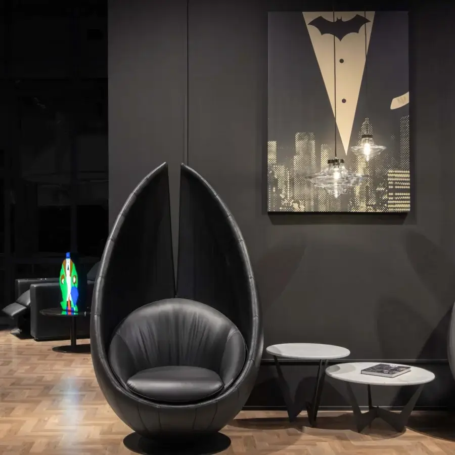 Superior WAYNE Enterprises WE-003H lounge chair built in sleek black premium leather with a glossy metal swivel base