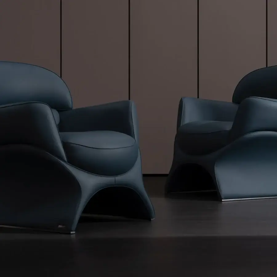Elegant Mascheroni La Goccia lounge chair with dynamic curved geometries and dark blue synthetic leather upholstery