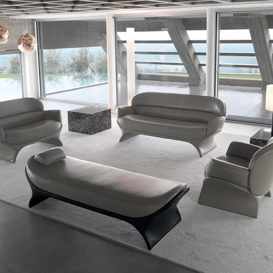 Superior Mascheroni La Goccia lounge chair sculpted from a single block upholstered in light gray leather with integrated armrests