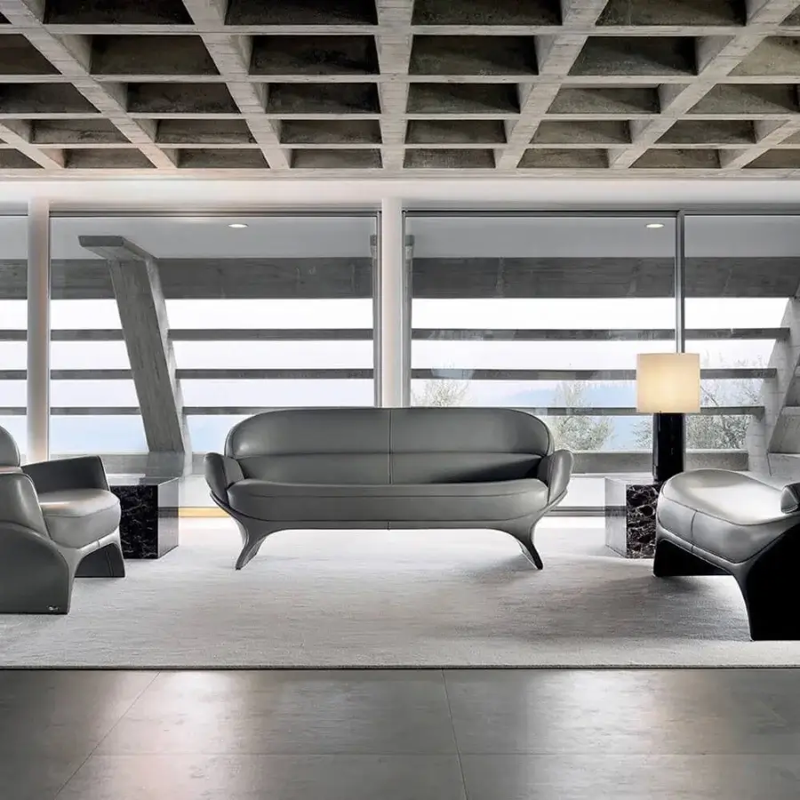 Distinguished Mascheroni La Goccia lounge chair sculpted from a single block upholstered in dark gray leather with black and metal support detail