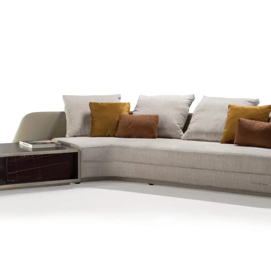 Distinguished Reflex Stratum sectional with layered light gray textile and beige synthetic material, accented by brown and mustard cushions with a dark wood console