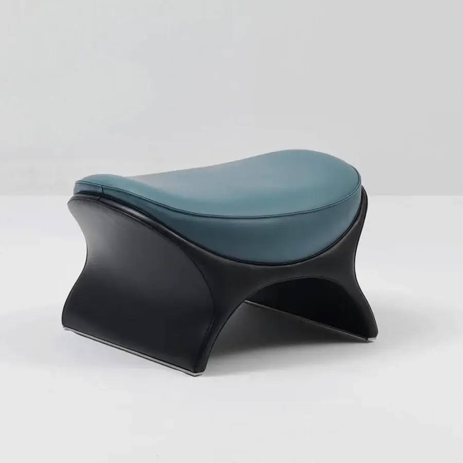 Captivating Mascheroni La Goccia ottoman crafted in smooth blue-green leather with a dark matte base showcasing sculptural form