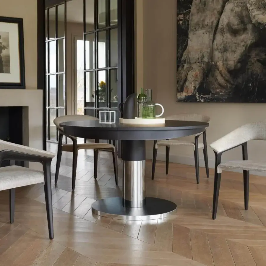 Distinguished Potocco Diva table with a refined round top and circular base built in oak and metal with a dark matte finish