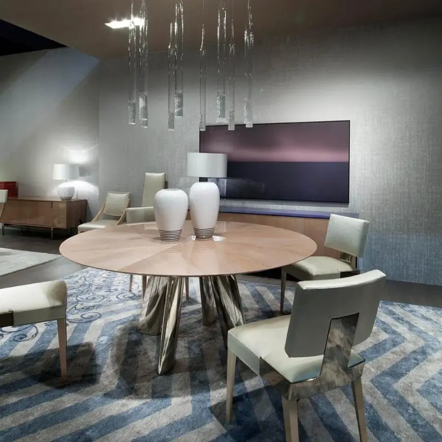 Distinguished Costantini Pietro table with a glossy beech wood top and sculptural stainless steel legs