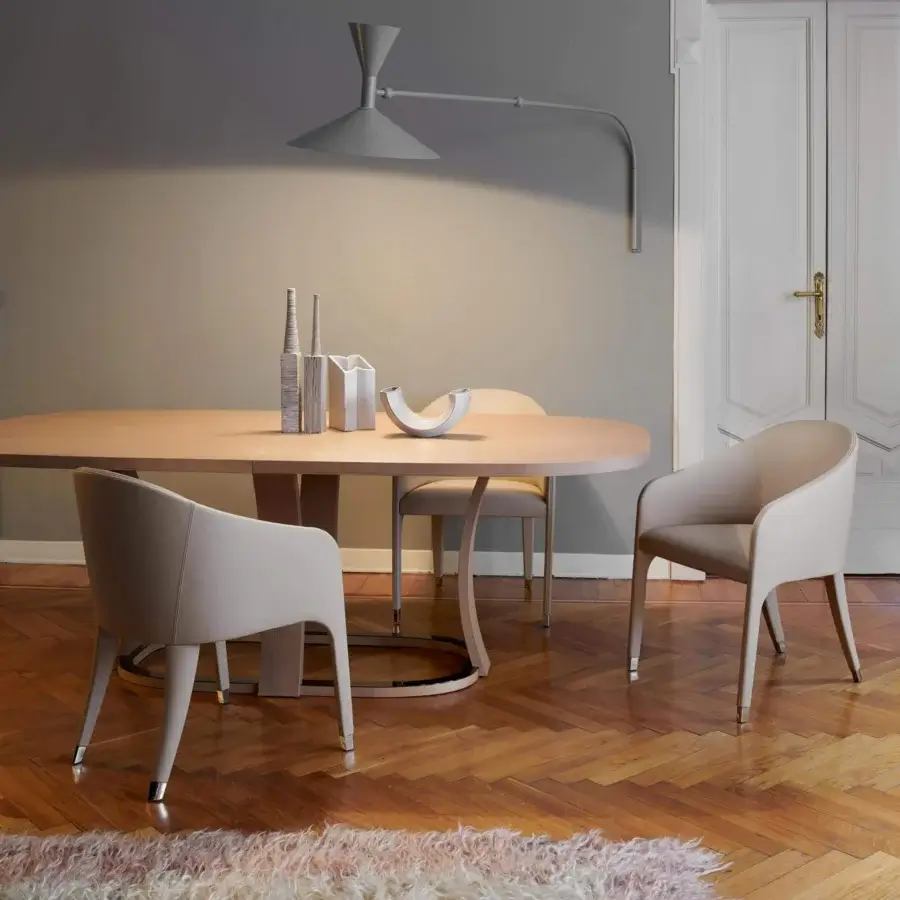 Distinctive Potocco Miura armchair upholstered in light beige fabric with meticulously stitched curves and sleek metallic leg tips