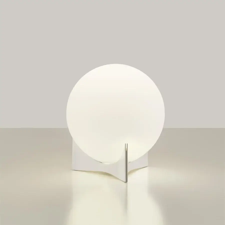 Innovative Terzani Oscar lamp with a white glass orb diffuser and curved geometric base crafted in Italy