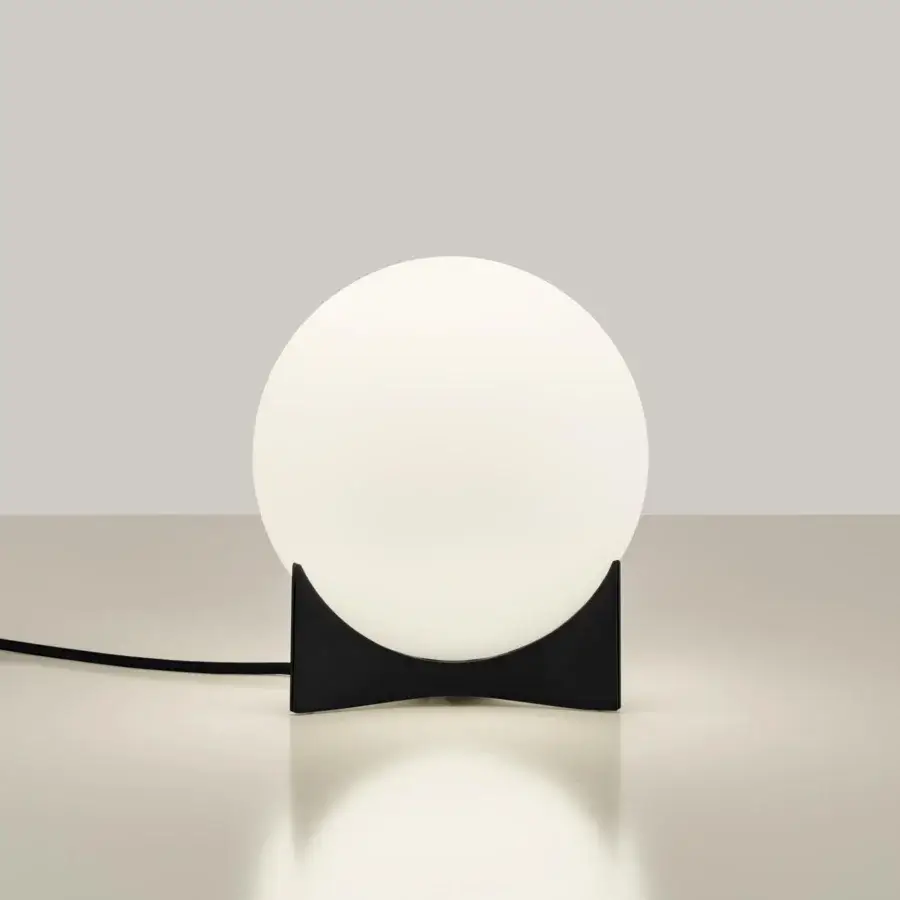 Superior Terzani Oscar lamp with a luminous white glass orb and matte black curved structure