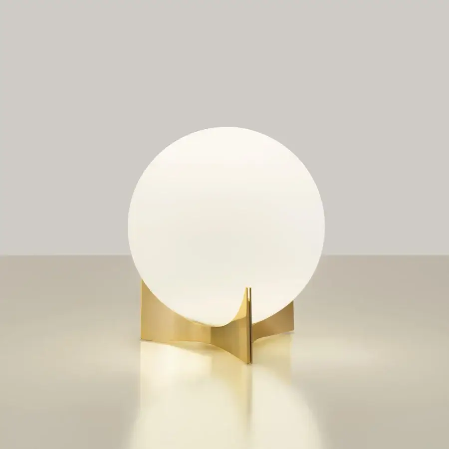 Elegant Terzani Oscar lamp with a luminous white glass orb delicately built in curved glossy gold metalwork