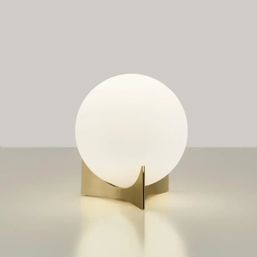 Innovative Terzani Oscar lamp with a white glass orb held by a gold finished curved metal structure