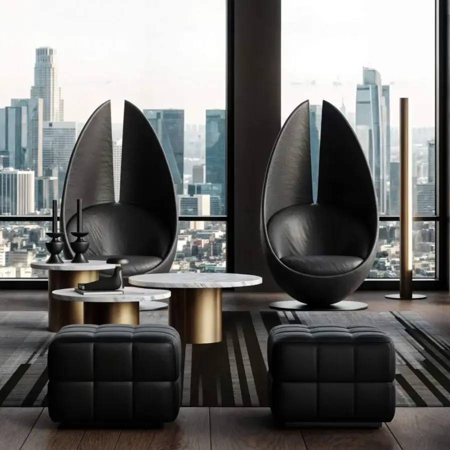 Superior egg chairs crafted in quilted material with white marble tables and gold cylindrical bases