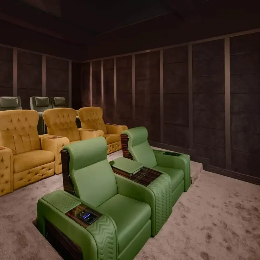 Superior Vismara Chest home cinema seating upholstered in textured green, brown and yellow textile with lacquered matte wood and chrome steel cupholders