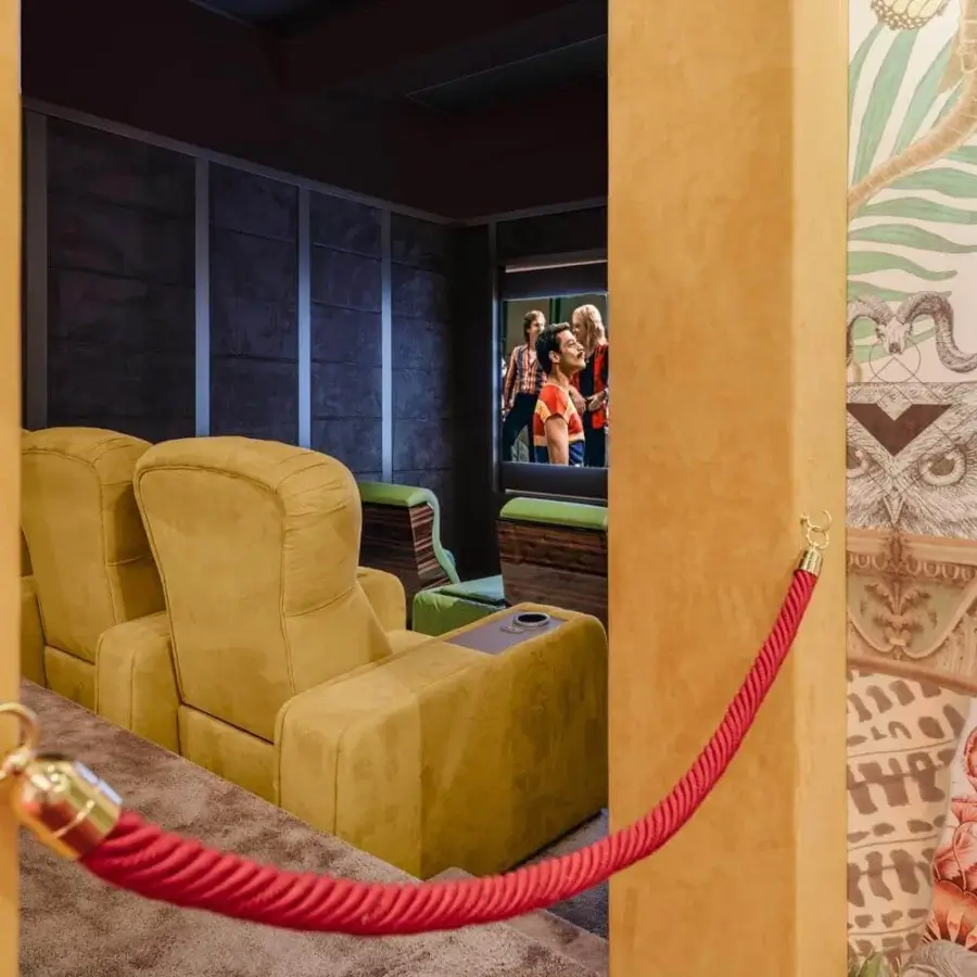 Distinguished Vismara Chest home cinema seating upholstered in vibrant yellow textile with tufted detailing and lacquered wood armrests