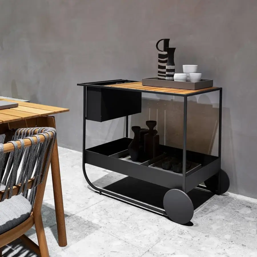 Elegant Potocco Butler bar cart built with Iroko wood top and sleek matte black metal frame with curved legs