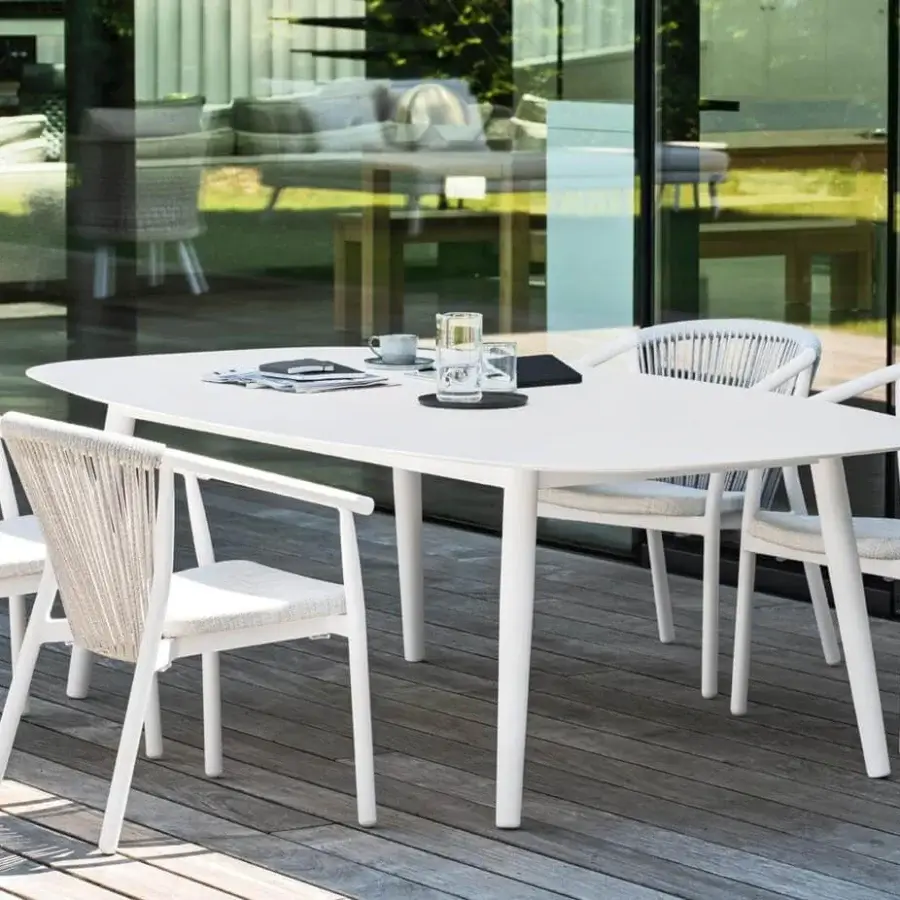 Distinguished Varaschin Ellisse table with a rounded rectangular shape and matte white HPL top crafted with powder-coated aluminum