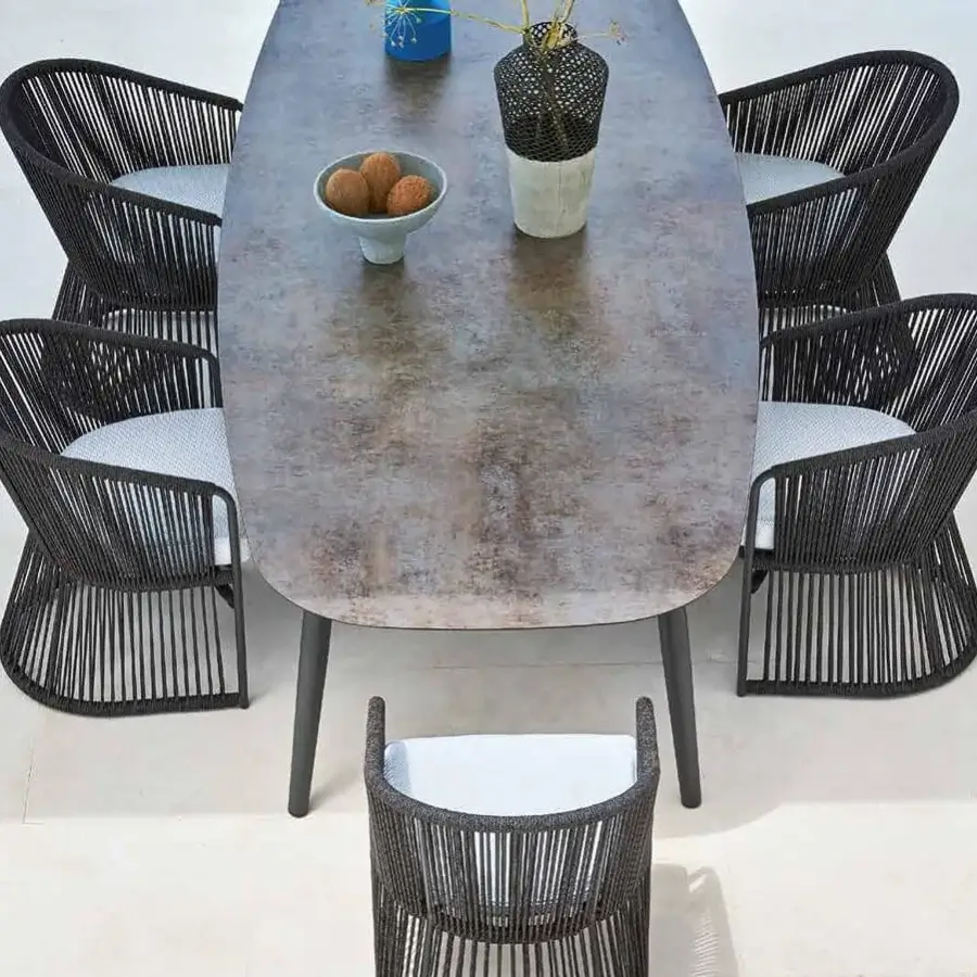 Distinguished Varaschin Ellisse table with a mottled grey ceramic top and sleek powder-coated aluminum legs