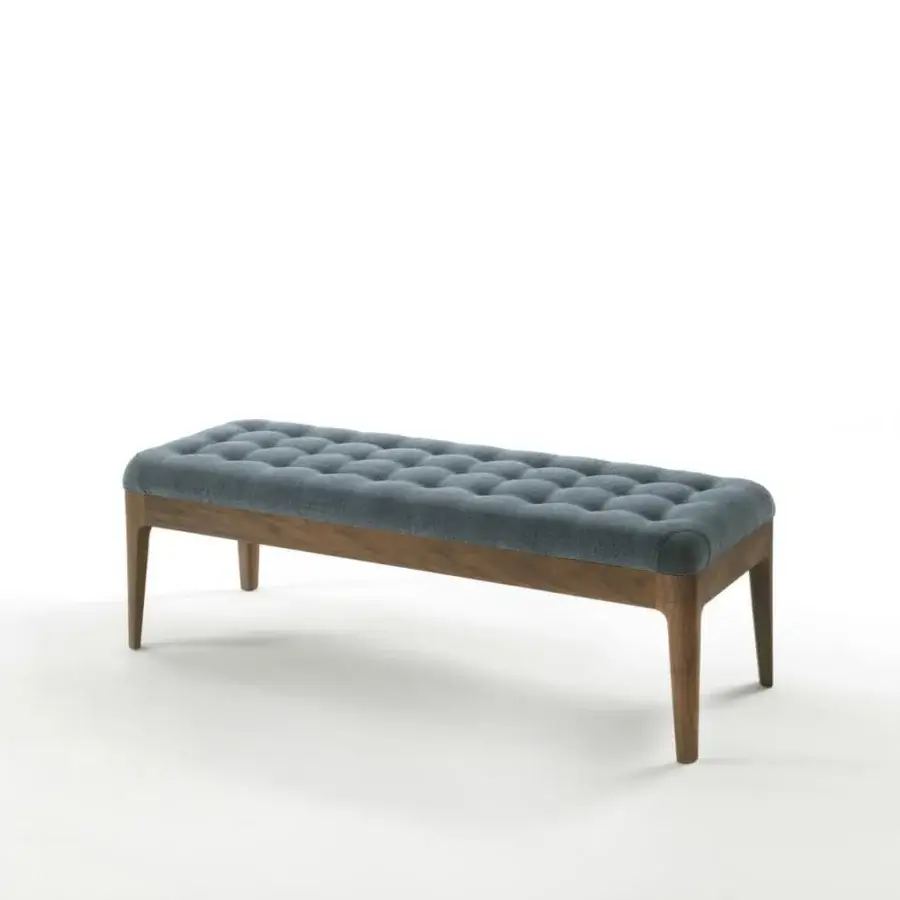 Sophisticated Porada Webby ottoman with button-tufted blue-gray textile and smooth canaletto walnut base