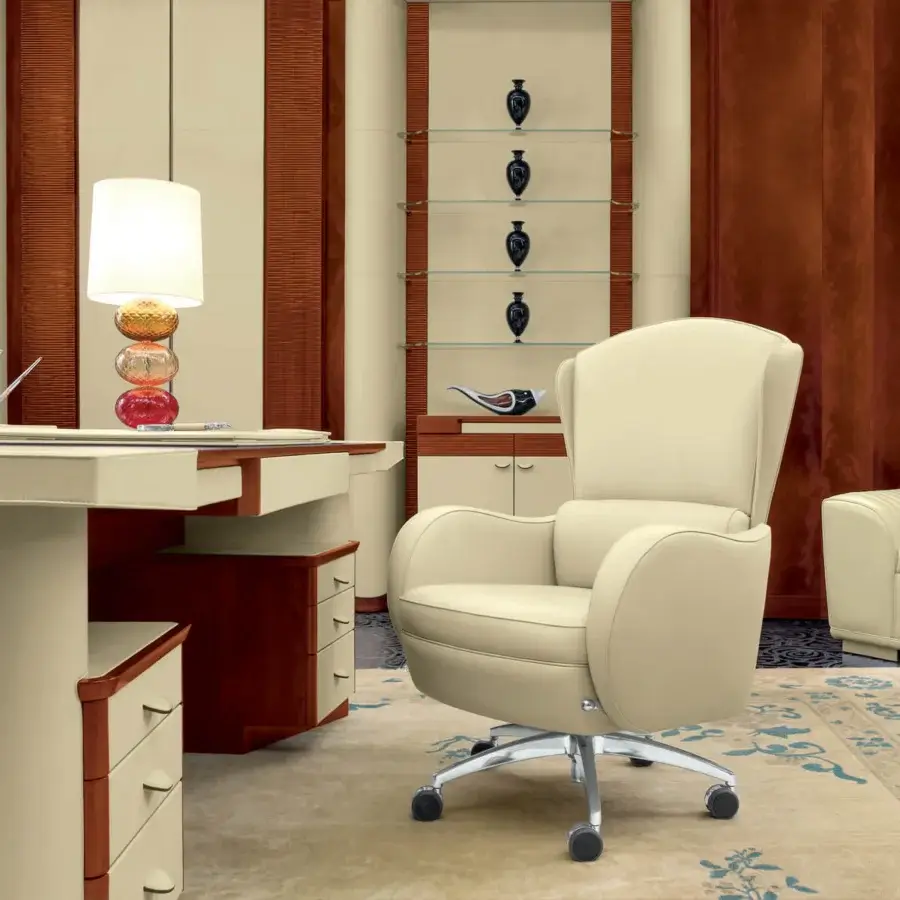 Distinguished Mascheroni I.E.D armchair crafted in cream leather with a steel 5-spoke swivel base and castors for mobility