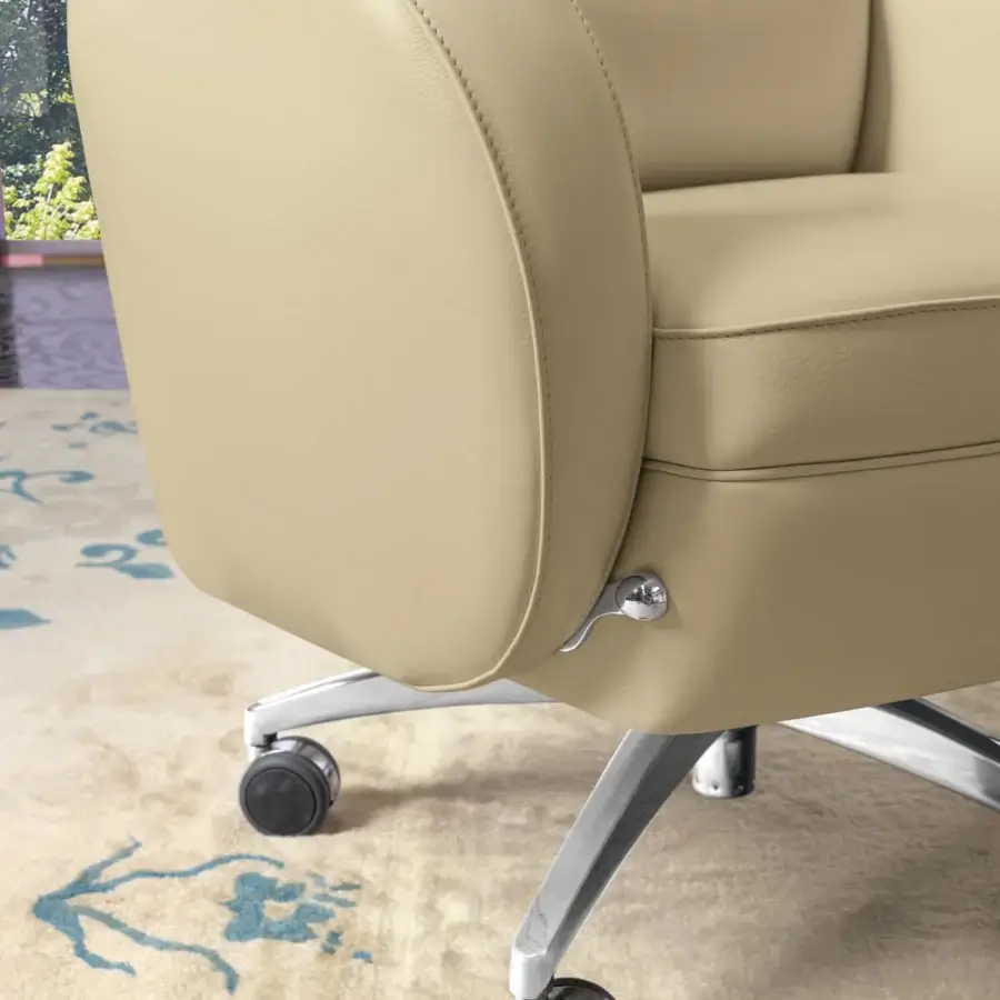 Refined Mascheroni I.E.D armchair upholstered in light beige leather with a steel 5-spoke swivel base and syncro-mechanism for optimal comfort