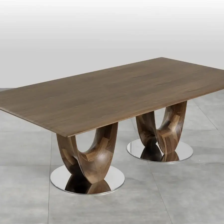 Elegant Pacini & Cappellini Axis table with veneered wood top and sculptural brown wooden bases grounded by chromed metal plates