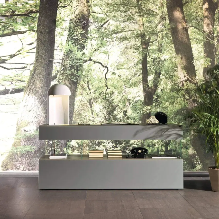 Innovative Lago Air sideboard with transparent tempered glass supporting matte grey blocks and XGlass textures