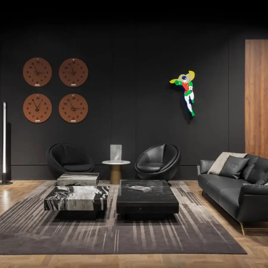 Elegant WAYNE Enterprises WE-001 sofa upholstered in sleek black textile with gold finish metal legs