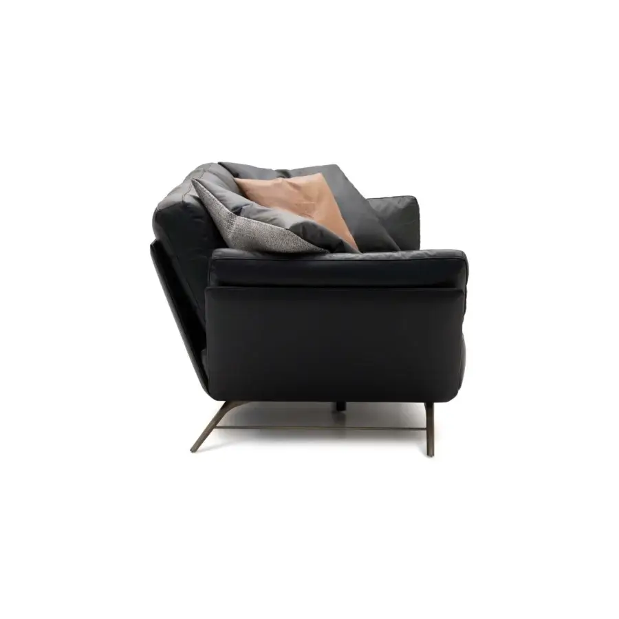 Distinctive WAYNE Enterprises WE-001 sofa upholstered in sleek black leather with bronze metal feet