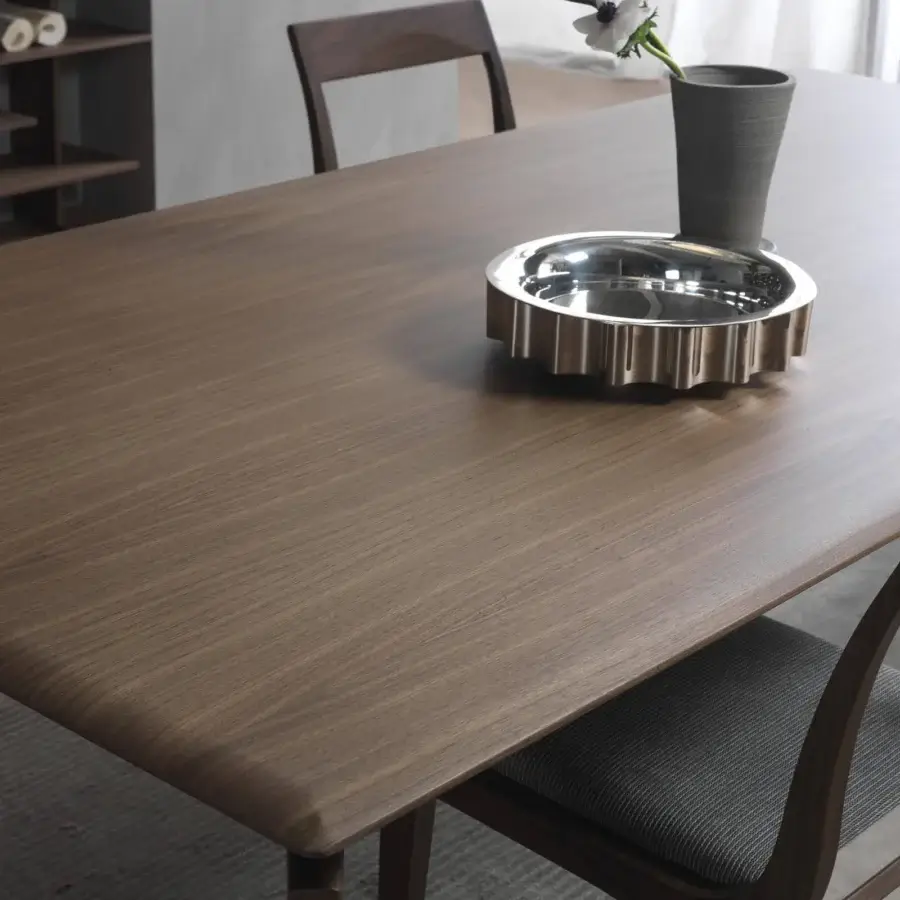 Distinguished Pacini & Cappellini Hope table crafted in medium brown wood with visible grain and uniquely divided legs demonstrating modern class