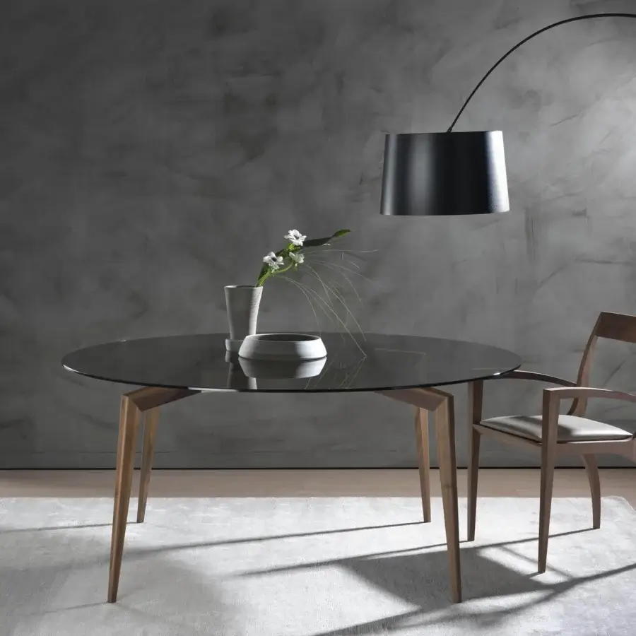 Refined Pacini & Cappellini Hope table with transparent glass and light-toned solid wooden legs angled gracefully outward