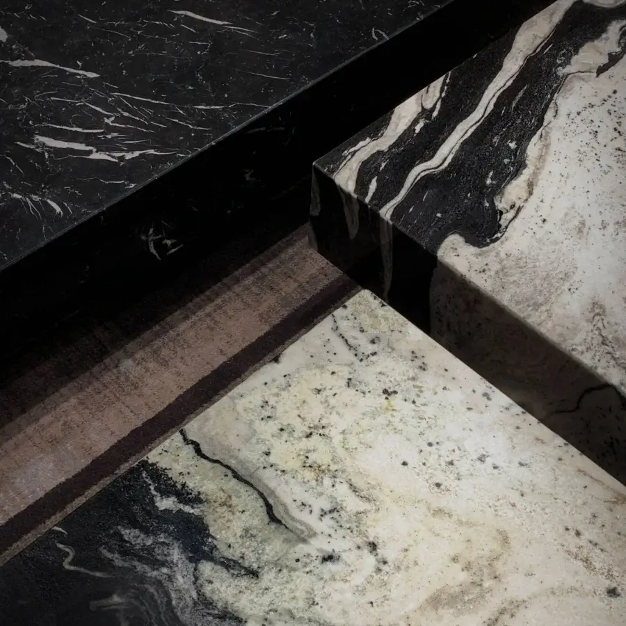 Superior WAYNE Enterprises WE-159 coffee table with multi-tiered marble blocks in black, white, gray and beige, plus a lacquered base