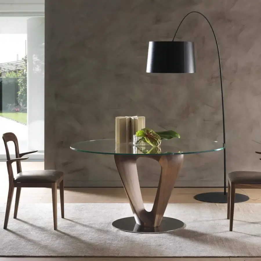 Harmonious Pacini & Cappellini Mobius table with a sinuous wooden base and transparent tempered glass top in chromed metal