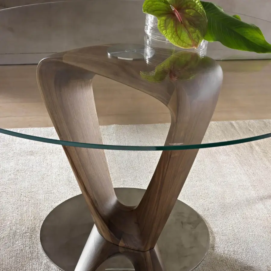 Exceptional Pacini & Cappellini Mobius table with a sinuous wooden base and clear tempered glass top crafted with a glossy finish