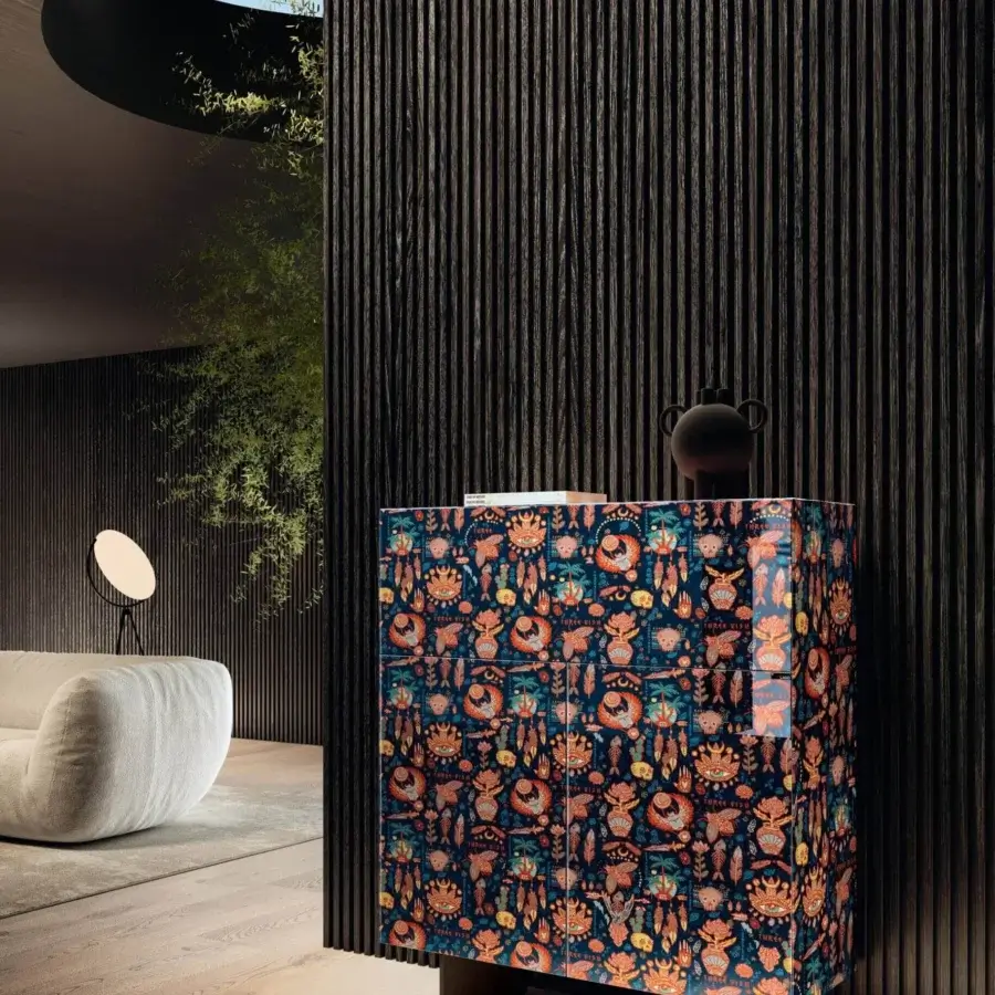 Exclusive Lago Materia cupboard with dark blue glossy finish and ornate patterned glass supported by elegant metal elements