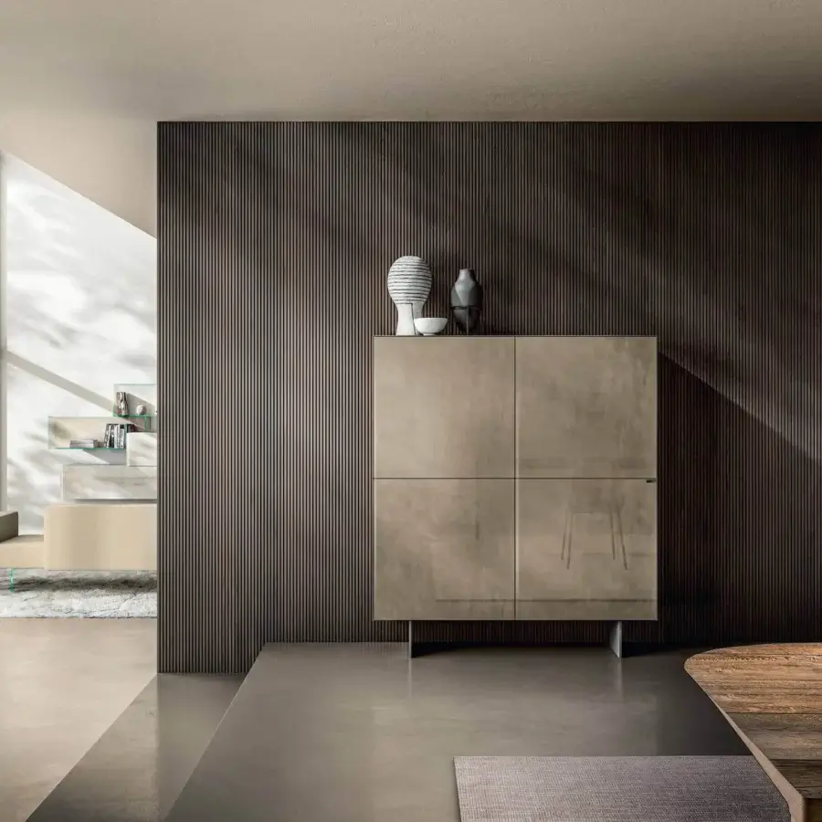 Elegant Lago Materia cupboard with linear design in muted taupe finish and refined metal supports