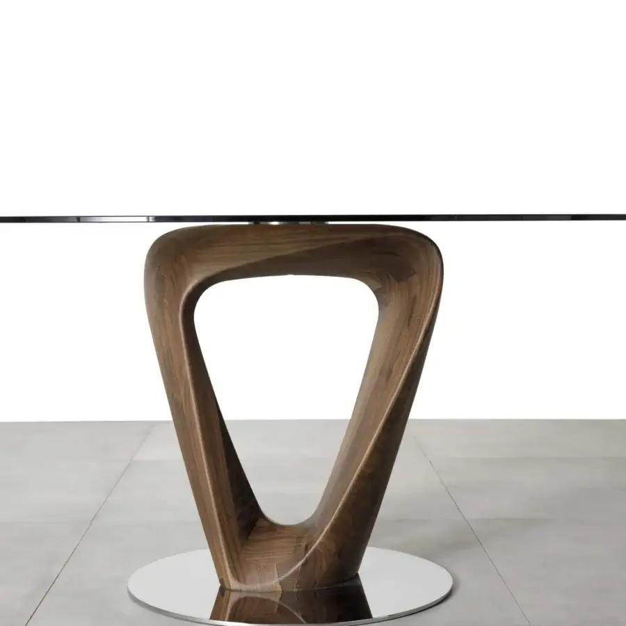 Harmonious Pacini & Cappellini Mobius table with sinuous wooden bases and clear tempered glass top in chromed metal