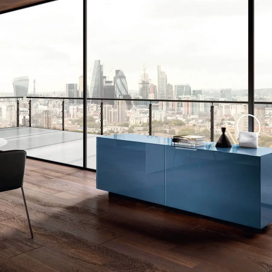 Distinguished Lago Plenum sideboard with coplanar sliding glass doors and a glossy blue finish reflecting light