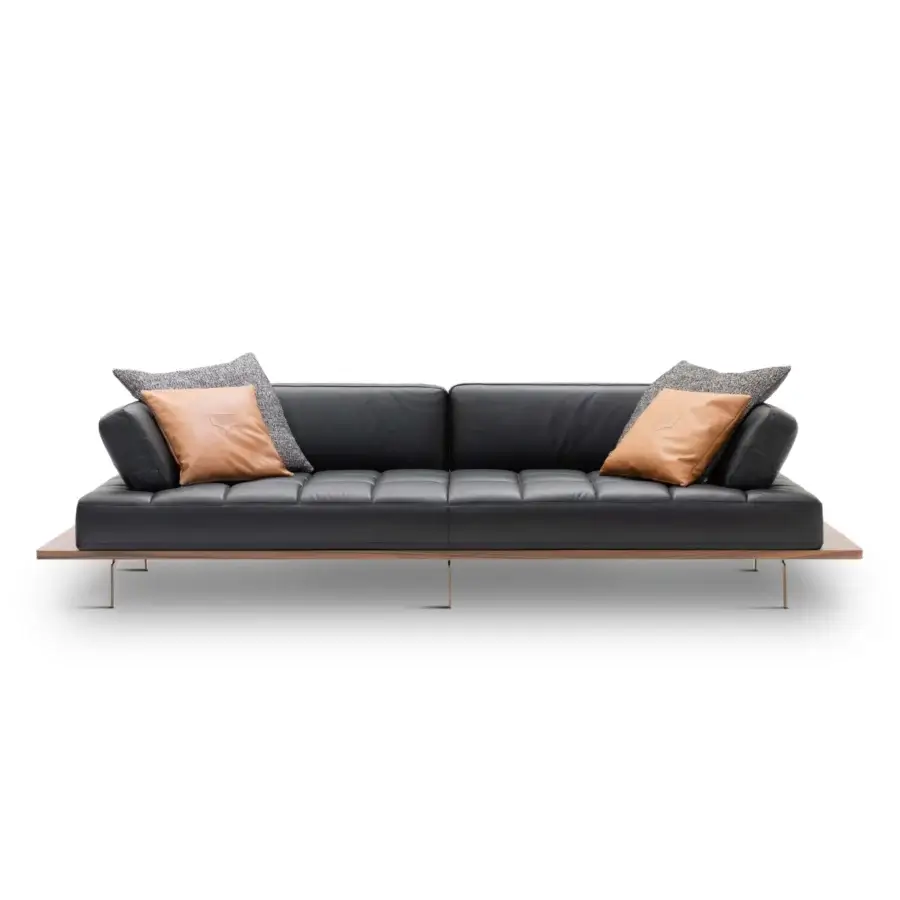 Exclusive Wayne Enterprises WE-029 sofa in dark leather upholstery with a wood veneer base and gold finished metal feet