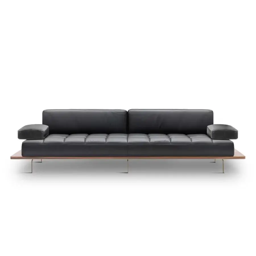 Avant-garde WAYNE Enterprises WE-029 sofa in sleek black leather with a satin wood veneer base and thin metal feet