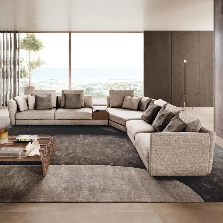 Sophisticated Pacini & Cappellini Ester sectional in light beige woven textile with a concealed base and integrated wooden side table