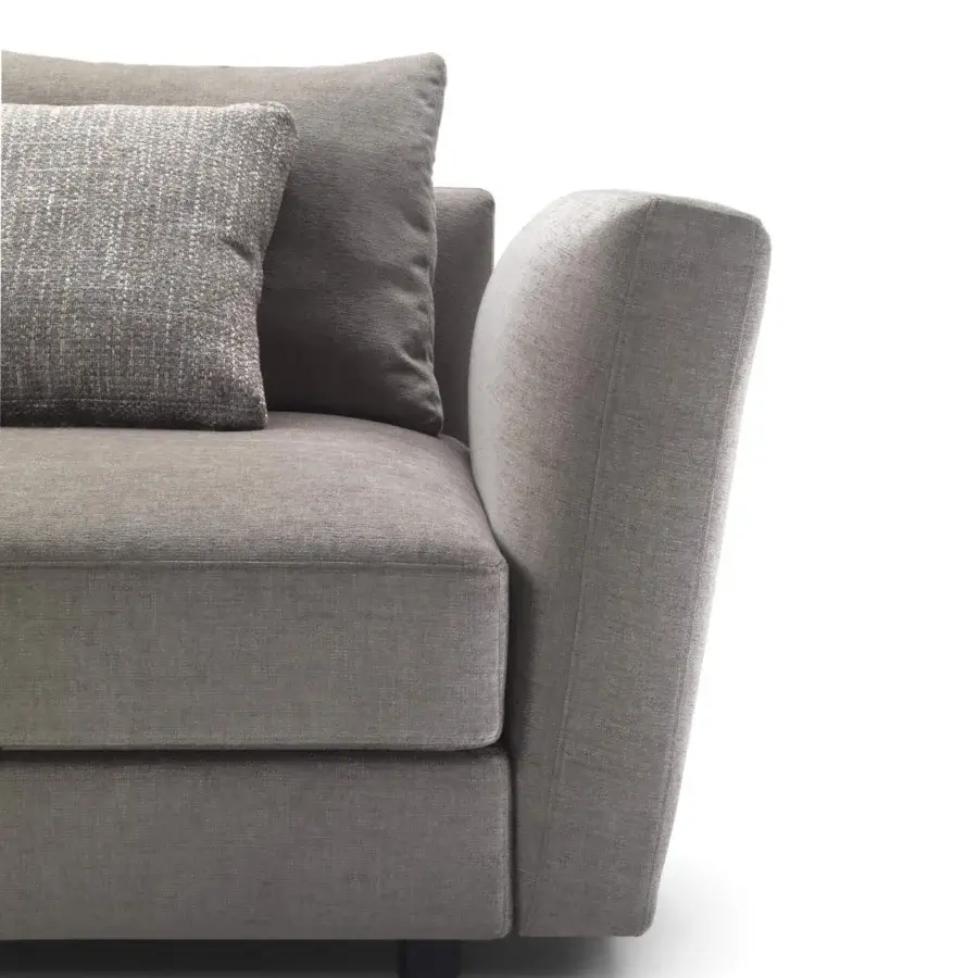 Superior Pacini & Cappellini Ester sectional upholstered in matte gray fabric with dark wooden feet