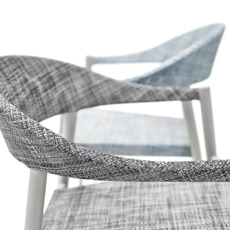 Refined Varaschin Clever armchair with a powder-coated aluminum frame and VAR#TEX fabric in a grayscale, plaid-like textile