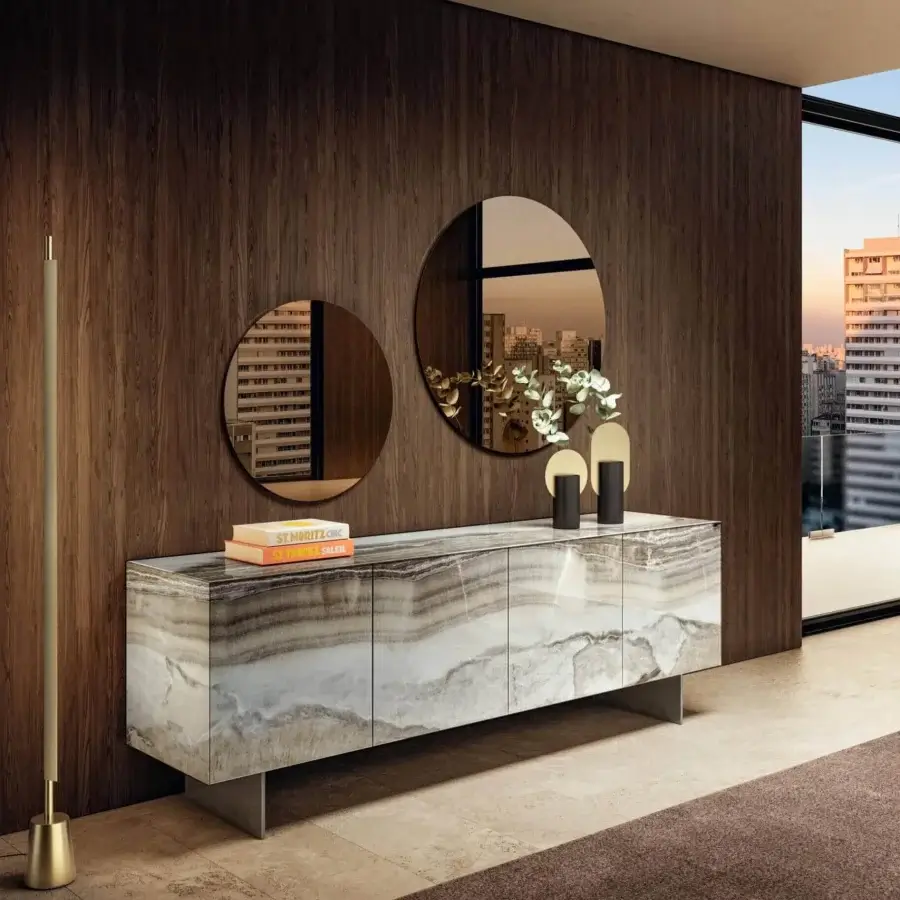 Elegant Lago Materia sideboard with legs in XGlass marble exhibiting swirling white, gray, and beige tones with a stainless steel base
