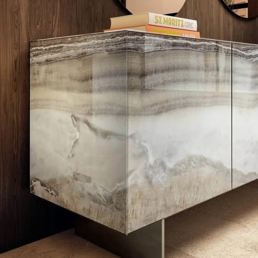 Distinguished Lago Materia sideboard with legs exhibiting a glossy XGlass finish layered in white, beige and grey tones with a dark metal base