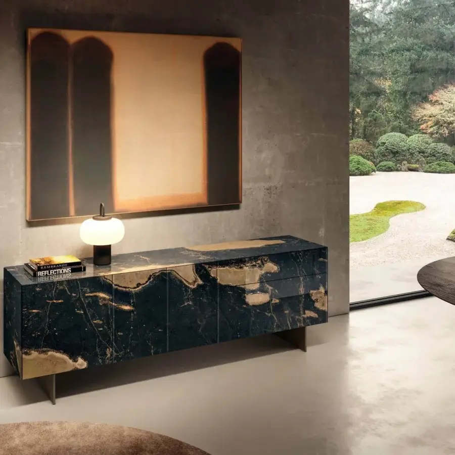 Exclusive Lago Materia sideboard with legs displaying a glossy XGlass marble finish and thin gold-colored metal legs