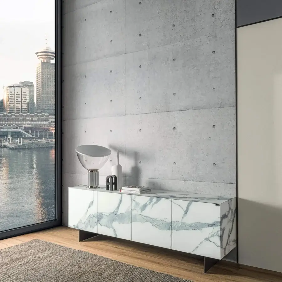 Elegant Lago Materia sideboard with legs displaying glossy white marble and luminous XGlass with distinctive blue-grey veining