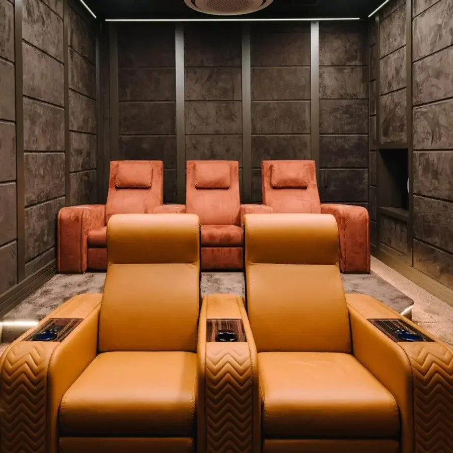 Superior Vismara Onassis Home Cinema seating crafted in Coconut Milk leather with quilted armrests and polished Ebony Makassar accents